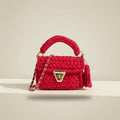 Pink crochet handbag with gold accents